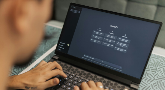 A person using ChatGPT on their laptop.